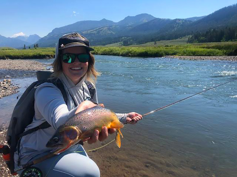 Female angler with cutthroat trout