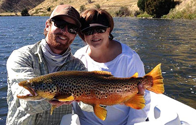 Husband and wife pose with fish