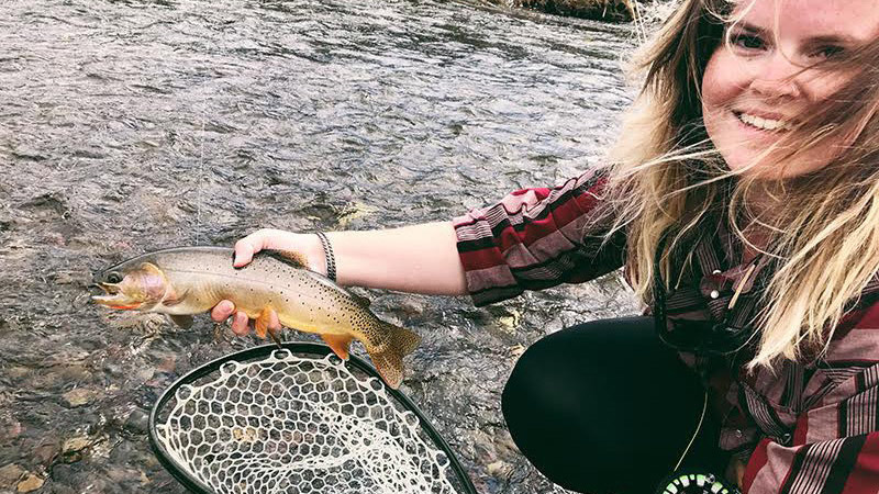 Female angler with landing net