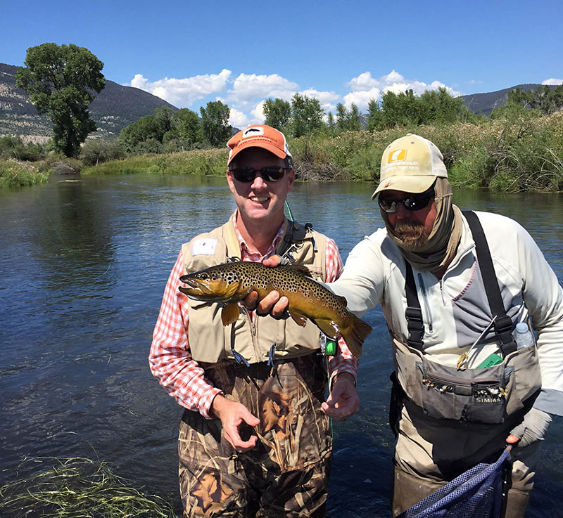 Guide and client with trout