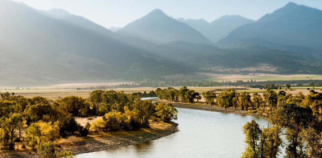 A large river running into the mountains